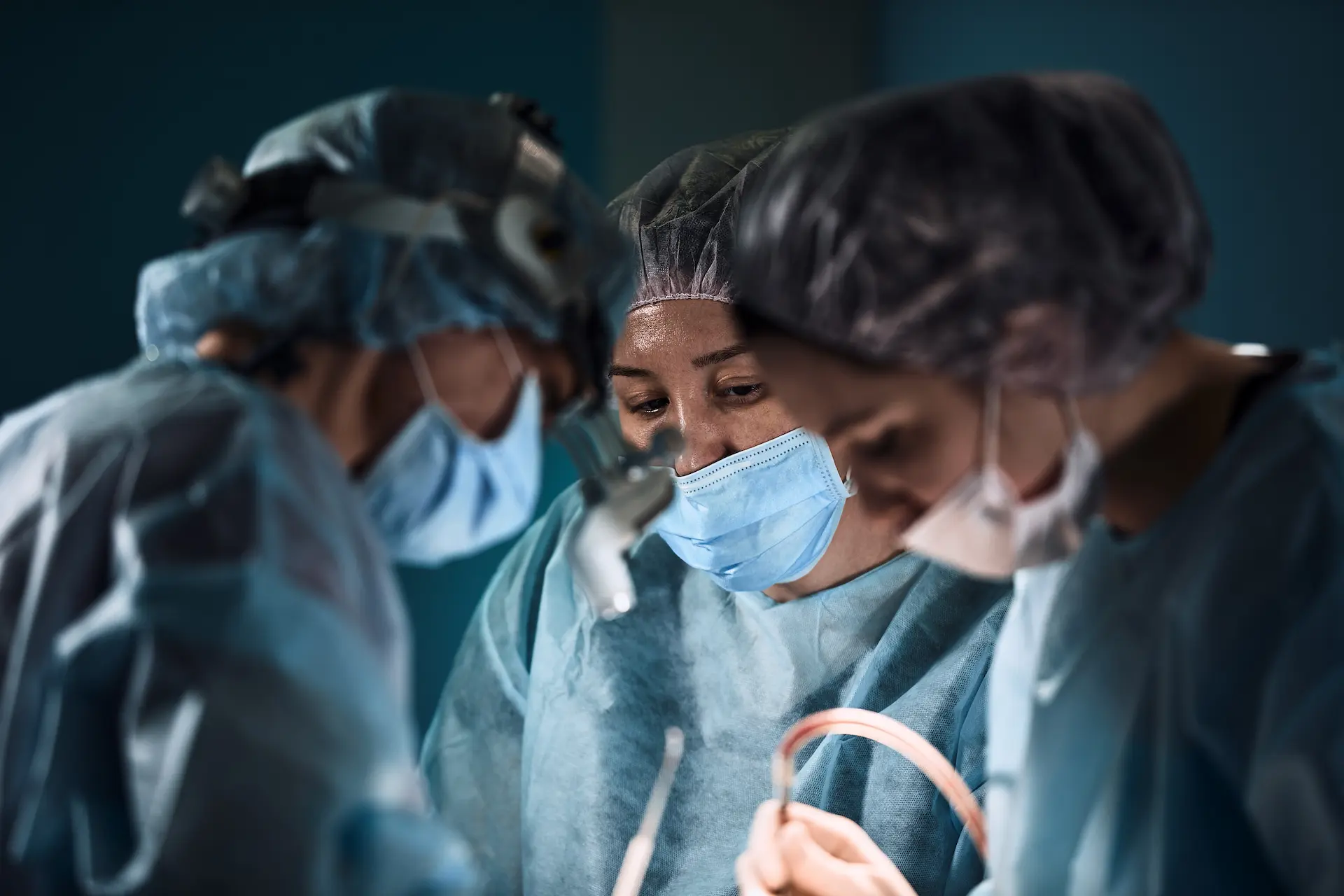 a team of surgeons operating